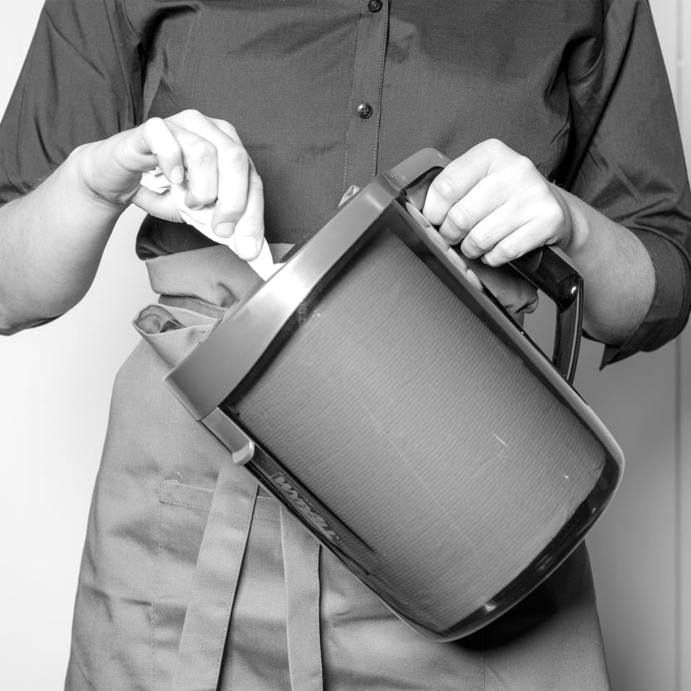 A Person Holding a Full 6221 Paper Hand Towel Centrefeed Dispenser