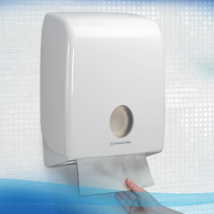 A Person Using a White 6617 Paper Hand Towel Dispenser