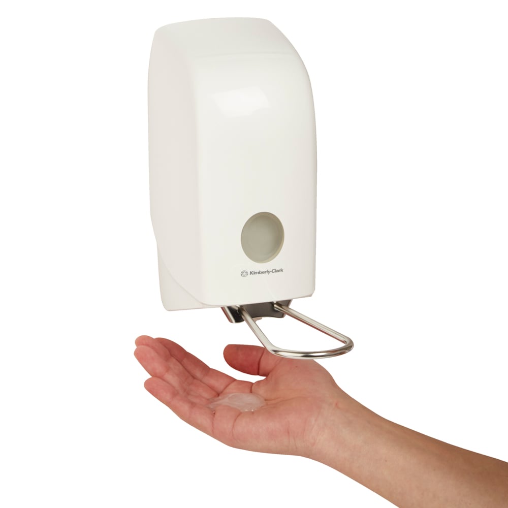 A Person Using a Single White 6955 Kimberly Clark Hand Sanitiser Dispenser