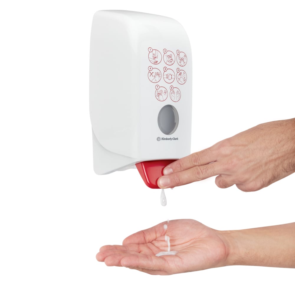 A Person Using a White and Red Kimberly Clark 7124 Hand Sanitiser Dispenser