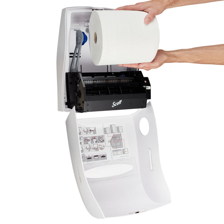 A Person Putting a White Roll of Paper into a White and Black Scott 9960 Paper Hand Towel Dispenser