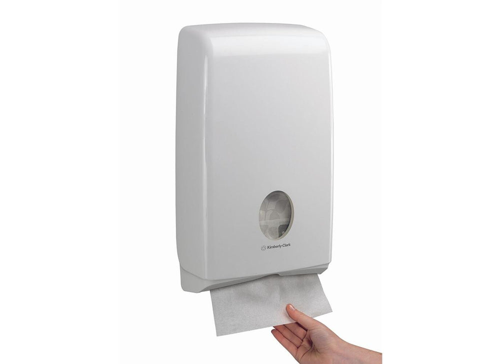 A Person Using a White U7024 Aquarius Slimfold Hand Towel Dispenser