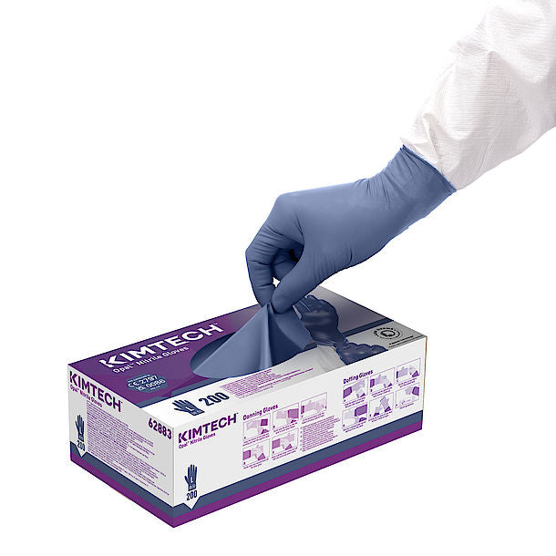 A Person Taking a Glove out of a White and Purple Box of Kimtech 62883 Opal Nitrile Gloves